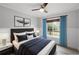 Bright bedroom with window, wood-look floors, and neutral decor at 21342 S Buckhill Rd, Clermont, FL 34715