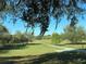 Long private driveway leading to home, surrounded by lush pastures at 21342 S Buckhill Rd, Clermont, FL 34715