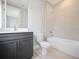 Bathroom with a toilet, bathtub and single vanity at 15942 Vetta Dr, Bella Collina, FL 34756