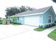 Attached garage with a long driveway at 36646 Oconee Ave, Eustis, FL 32736