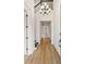 Light and spacious entryway with a modern chandelier at 15623 Vetta Dr, Montverde, FL 34756