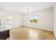 Bright dining room with hardwood floors and a large window at 15623 Vetta Dr, Montverde, FL 34756