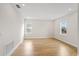 Spacious bedroom with hardwood floors and large window at 15623 Vetta Dr, Montverde, FL 34756