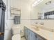 Bathroom with single sink vanity and shower/tub at 14850 Se 73Rd Ave, Summerfield, FL 34491