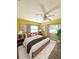 Spacious main bedroom with a king-size bed and yellow walls at 1501 N Cr 19A, Eustis, FL 32726