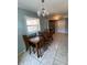 Dining area with a wood table and chairs, near kitchen at 1501 N Cr 19A, Eustis, FL 32726