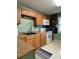 Kitchen featuring wood cabinets and modern appliances at 1501 N Cr 19A, Eustis, FL 32726