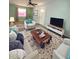 Living room with comfy seating and a rustic coffee table at 1501 N Cr 19A, Eustis, FL 32726