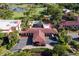 Aerial view of resort with pool, golf course, and buildings at 26142 Avenida Las Colinas # 2B, Howey In The Hills, FL 34737