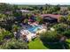 Resort pool area with lounge chairs and landscaping at 26142 Avenida Las Colinas # 2B, Howey In The Hills, FL 34737