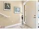 Interior entryway with art, a vase and carpeted stairs at 26142 Avenida Las Colinas # 2B, Howey In The Hills, FL 34737