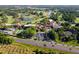 Aerial view of resort, showing buildings, golf course, and highway at 26142 Avenida Las Colinas # 2B, Howey In The Hills, FL 34737