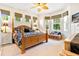 Main bedroom with a large bed and plenty of natural light at 26142 Avenida Las Colinas # 2B, Howey In The Hills, FL 34737