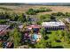 Aerial view of resort showing pool, buildings, and golf course at 26142 Avenida Las Colinas # 2B, Howey In The Hills, FL 34737