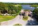 Grand entrance to the community, featuring landscaping and signage at 26142 Avenida Las Colinas # 2B, Howey In The Hills, FL 34737