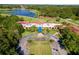 Aerial view of clubhouse with Spanish-style architecture at 26142 Avenida Las Colinas # 2B, Howey In The Hills, FL 34737