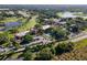 Aerial view of resort community with golf course and buildings at 26142 Avenida Las Colinas # 2B, Howey In The Hills, FL 34737