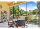Spacious screened balcony overlooking a lush green landscape at 26142 Avenida Las Colinas # 2B, Howey In The Hills, FL 34737
