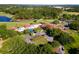 Aerial view of clubhouse near golf course and lake at 26142 Avenida Las Colinas # 2B, Howey In The Hills, FL 34737