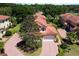 Aerial view of the house and its surroundings, showing the driveway and landscaping at 26142 Avenida Las Colinas # 2B, Howey In The Hills, FL 34737