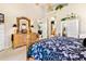 Main bedroom with dresser and ensuite bathroom at 26142 Avenida Las Colinas # 2B, Howey In The Hills, FL 34737