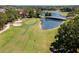 Golf course with pond, bridge and sand trap at 26142 Avenida Las Colinas # 2B, Howey In The Hills, FL 34737