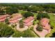 Aerial view showing the location of the homes near a golf course and lake at 26142 Avenida Las Colinas # 2B, Howey In The Hills, FL 34737
