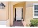White front door with sidelights, brick walkway and landscaping at 26142 Avenida Las Colinas # 2B, Howey In The Hills, FL 34737