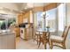 Kitchen nook with a glass-top table and wicker chairs, offering a bright and airy space at 26142 Avenida Las Colinas # 2B, Howey In The Hills, FL 34737