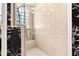 Large walk-in shower with glass enclosure and built-in shelving at 26142 Avenida Las Colinas # 2B, Howey In The Hills, FL 34737