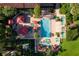 Overhead view of resort pool with surrounding lounge chairs at 26142 Avenida Las Colinas # 2B, Howey In The Hills, FL 34737