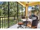 Enjoy the view from this screened balcony with outdoor seating at 26142 Avenida Las Colinas # 2B, Howey In The Hills, FL 34737