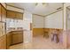 Kitchen with wood cabinets, granite countertops, and stainless steel appliances at 9930 County Road 114B, Wildwood, FL 34785
