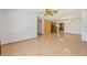 Large living room with tile floors and views to dining room at 9930 County Road 114B, Wildwood, FL 34785