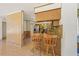 Kitchen with breakfast bar and wood cabinets at 9930 County Road 114B, Wildwood, FL 34785
