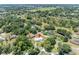 Aerial view of home, highlighting its location in a residential area at 9930 County Road 114B, Wildwood, FL 34785