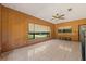 Bright Gathering room with wood paneling and large windows at 9930 County Road 114B, Wildwood, FL 34785