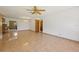 Living room with tile floors and access to other rooms at 9930 County Road 114B, Wildwood, FL 34785