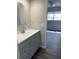 Bathroom with gray vanity and modern fixtures at 1921 Smitty Rd, Lady Lake, FL 32159