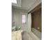 Bathroom with a shower/tub combo and brown tile at 1921 Smitty Rd, Lady Lake, FL 32159