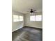 Bright bedroom with new flooring and ceiling fan at 1921 Smitty Rd, Lady Lake, FL 32159