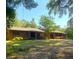 Brick ranch home with mature landscaping and a spacious yard at 1921 Smitty Rd, Lady Lake, FL 32159
