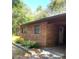 Brick house exterior with landscaping and walkway at 1921 Smitty Rd, Lady Lake, FL 32159