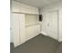 Garage with white cabinets and pegboard at 1921 Smitty Rd, Lady Lake, FL 32159