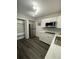 Modern kitchen with white cabinets and stainless steel appliances at 1921 Smitty Rd, Lady Lake, FL 32159