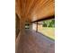 Covered patio with brick pavers and access to yard at 1921 Smitty Rd, Lady Lake, FL 32159