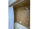 Shower stall with brown tile surround at 1921 Smitty Rd, Lady Lake, FL 32159