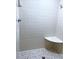 Clean shower with white tile and corner seat at 1921 Smitty Rd, Lady Lake, FL 32159