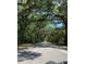 Long tree-lined driveway leading to the property at 1921 Smitty Rd, Lady Lake, FL 32159