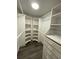 Spacious walk-in closet with ample shelving and hanging space at 1921 Smitty Rd, Lady Lake, FL 32159